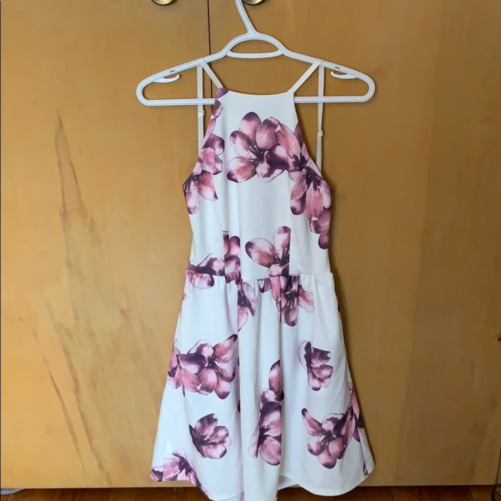A whit dress with purple flowers